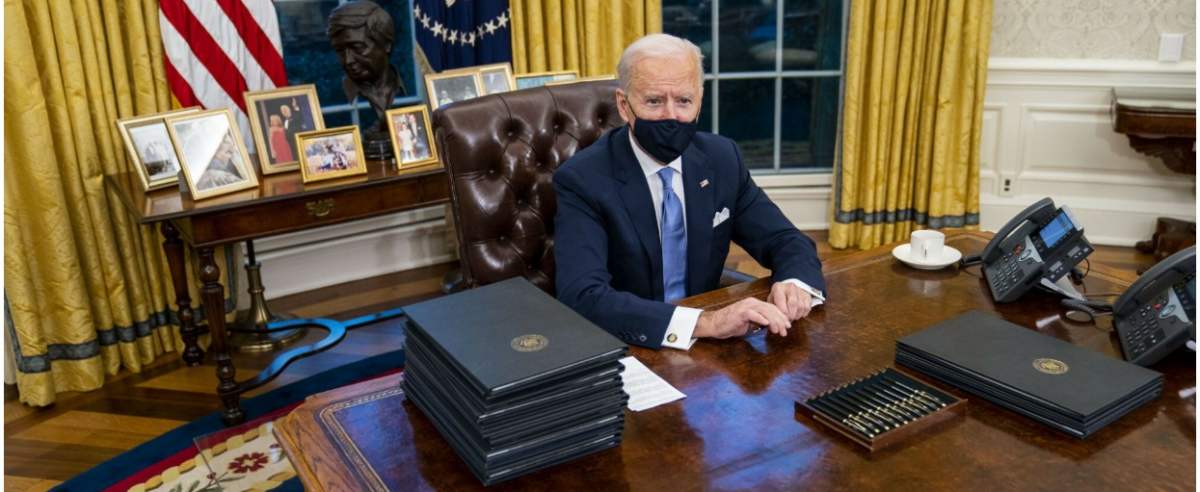 Mandatory Credit: Photo by Doug Mills/Shutterstock (11719538e) President Joe Biden signs executive orders during his first minutes in the Oval Office on Wednesday, January 20, 2021 at the White House in Washington, DC. President Biden as the 46th presiden