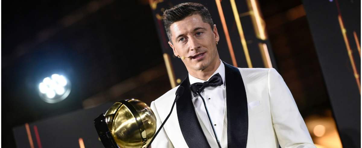 This handout picture made available on December 27, 2020 shows Polish footballer Robert Lewandowski accepting the "Player of the Year 2020" award during the 12th Dubai Globe Soccer Awards ceremony in Dubai. (Photo by Fabio FERRARI / La Presse / AFP) / ===