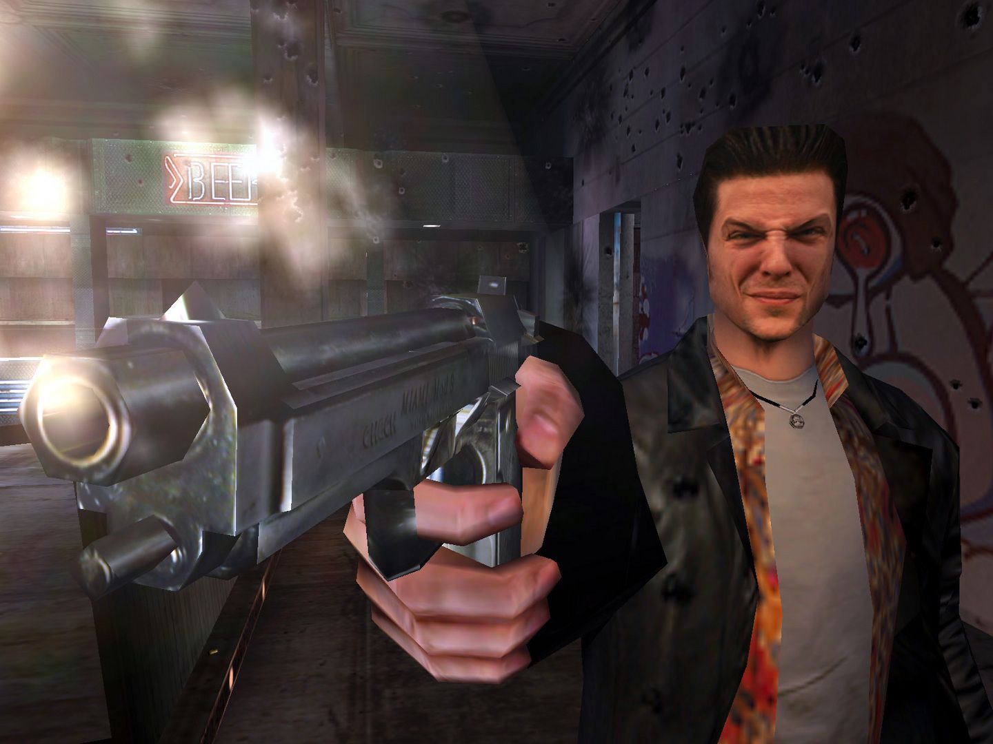Max Payne z wycelowaną w ekran bronią.